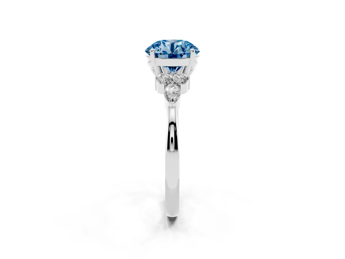Fancy Blue Round Cut Brilliant Diamond Solitaire Ring with Pear Side Stones and Four-Prong Setting Silver