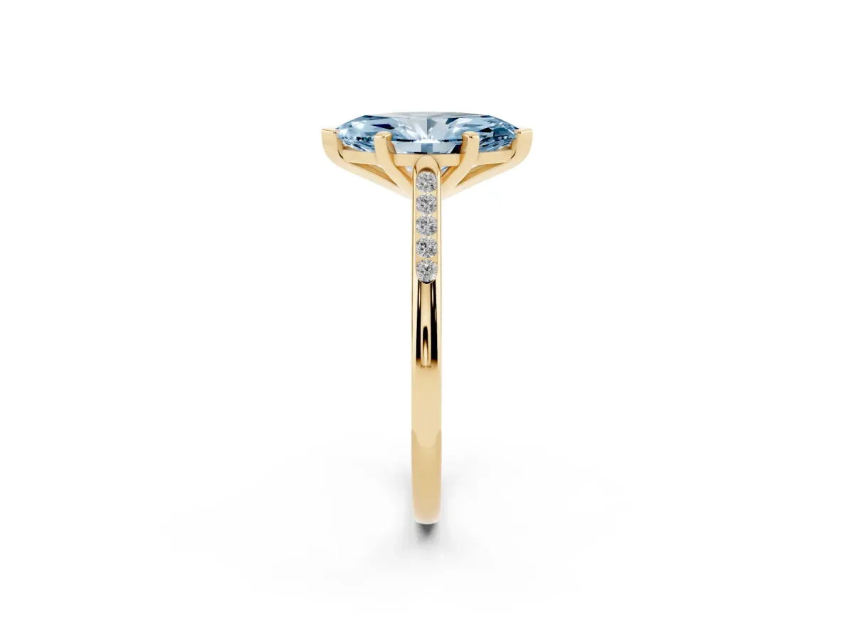 Fancy Blue Marquise Cut Diamond Solitaire Ring with Channel Set Round Band and Prong Setting Yellow gold