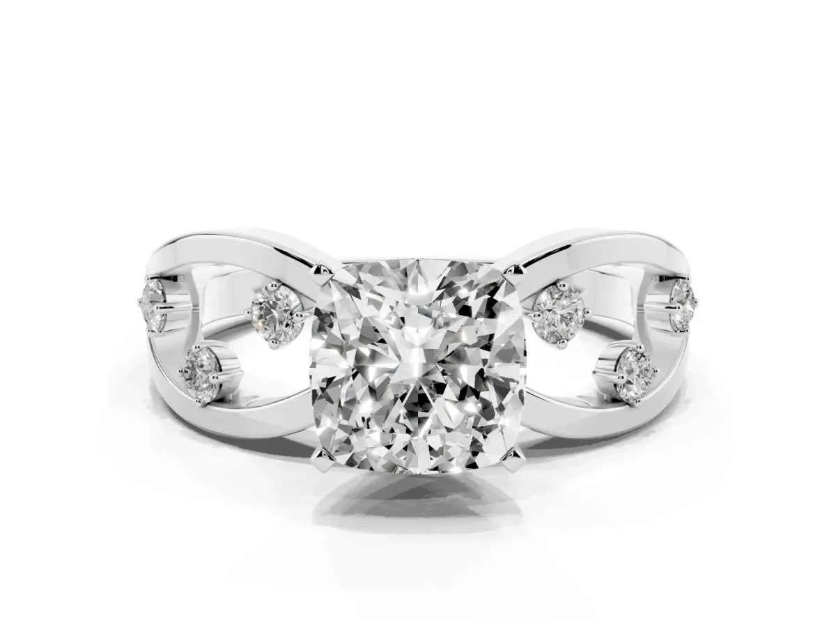 Cushion Cut Cut Solitaire Diamond with Side Stones on Criss-Cross Band and Four-Prong Setting Silver