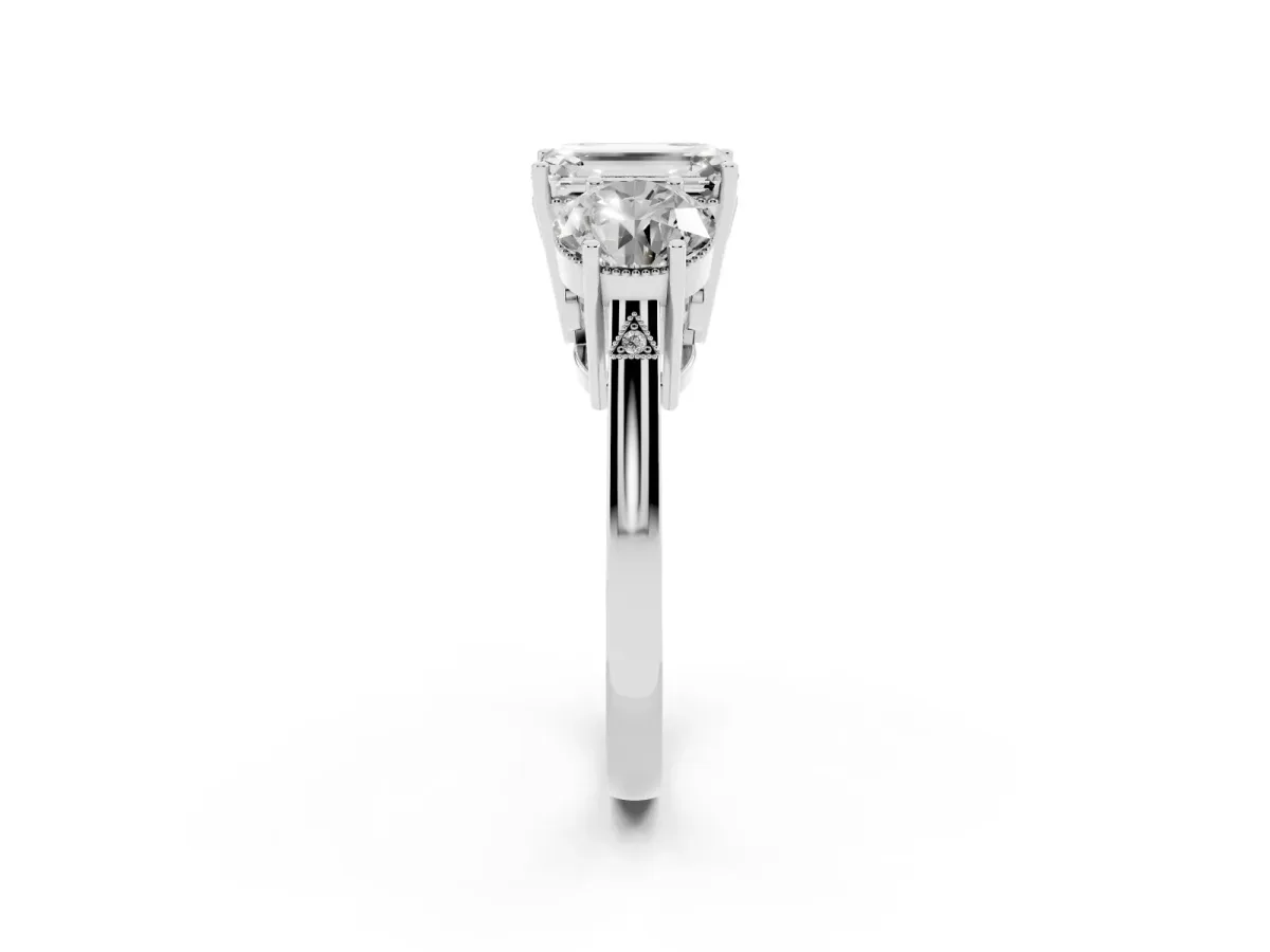 Three-Stone Emerald Cut Diamond Engagement Ring with Prong Setting on a Classic Band Platinum