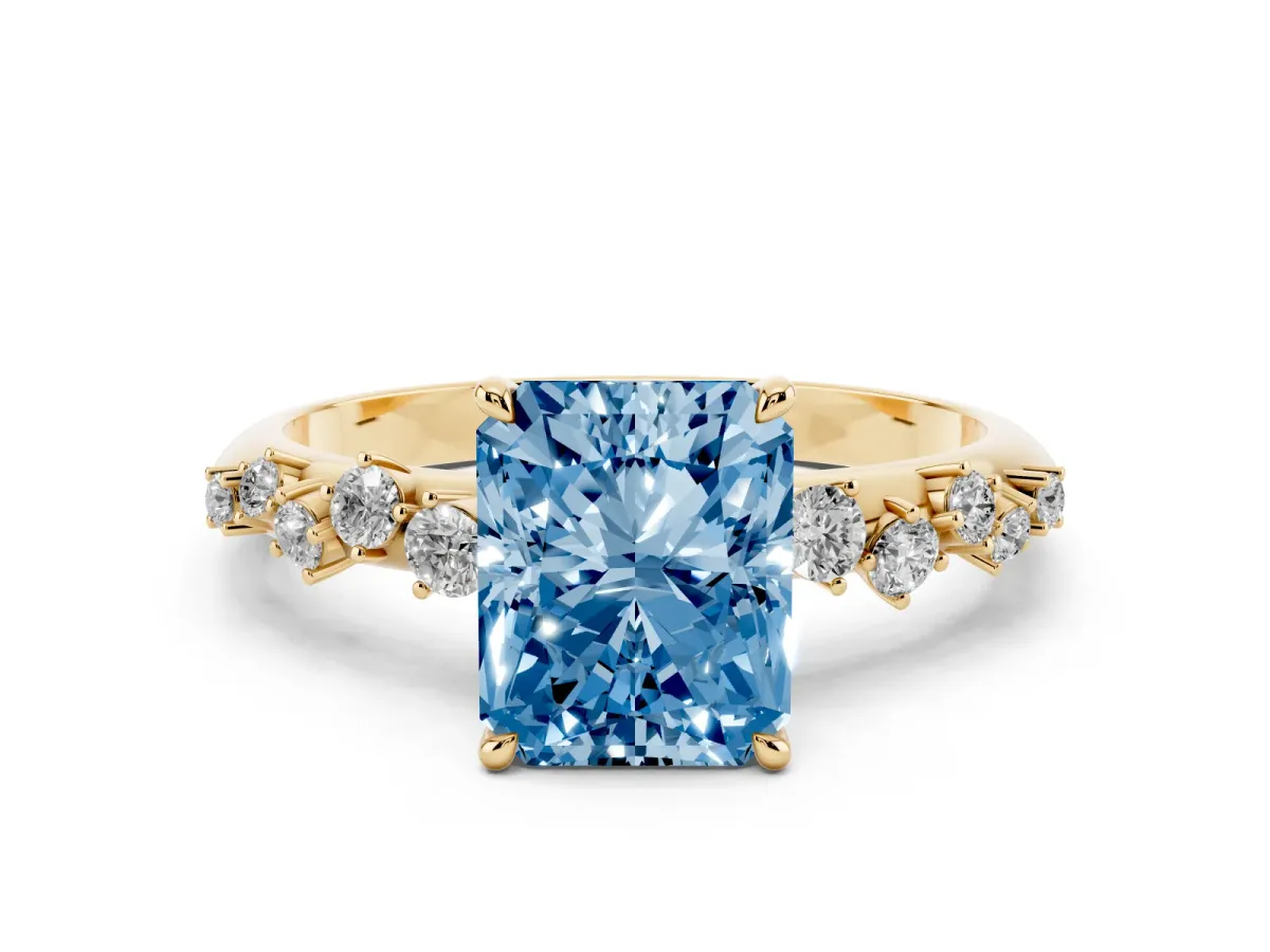 Fancy Blue Radiant Cut Diamond Cluster Side Stone Solitaire Ring with Prong Setting Yellow gold