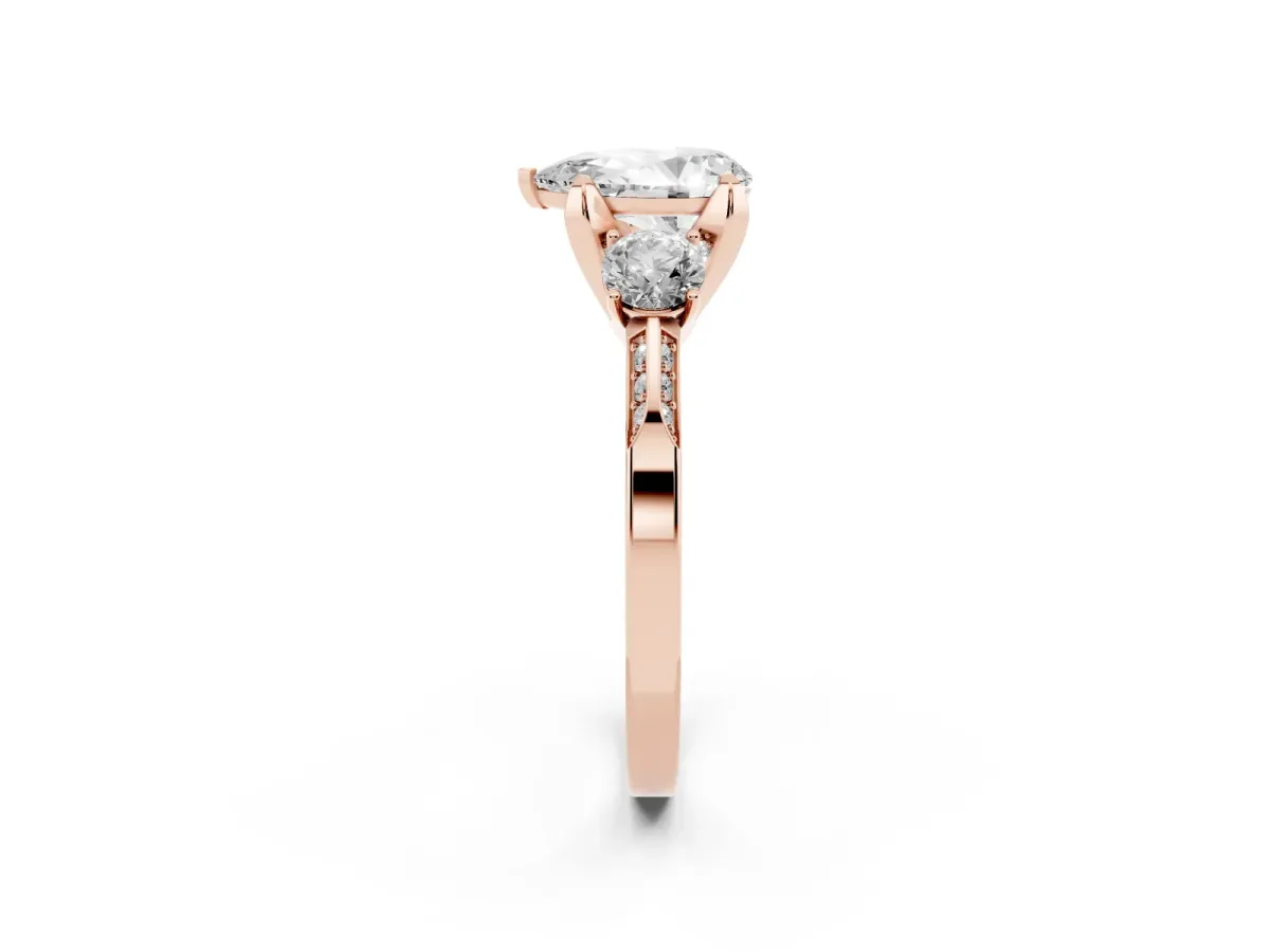 Pear Cut Brilliant Three-Stone Diamond Ring with Pavé Band and Four-Prong Setting Rose gold
