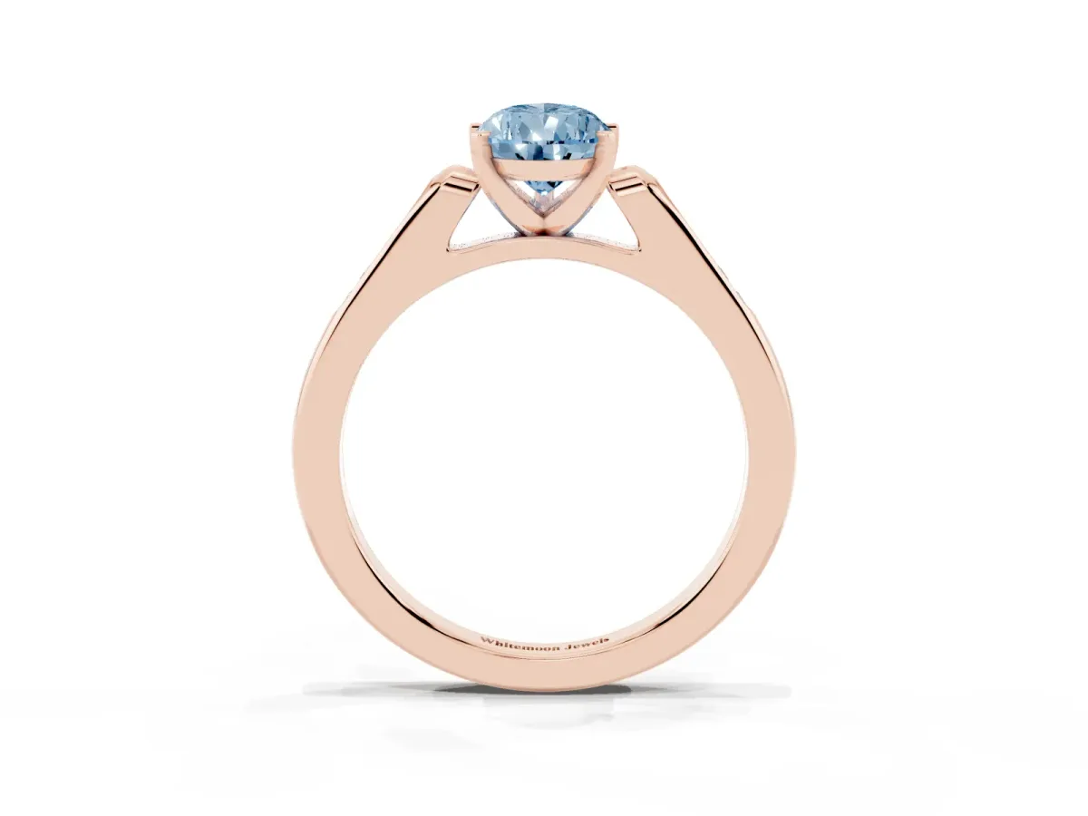 Fancy Blue Pear Cut Diamond Solitaire Ring with Channel Set Round Band and Prong Setting Rose gold