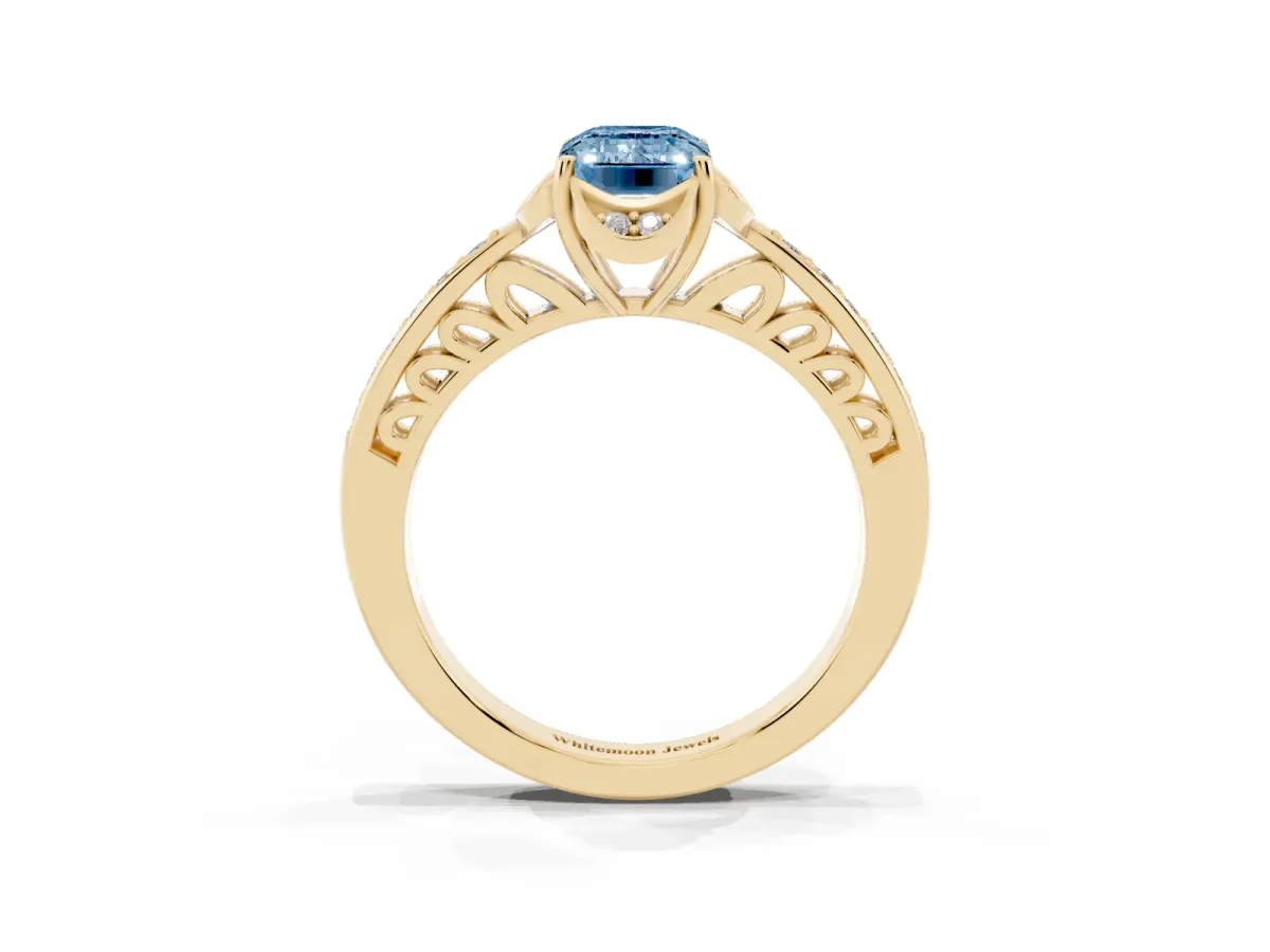 Fancy Blue Emerald Cut Cut Halo Diamond Ring with Channel Set Band and Four-Prong Setting Yellow gold