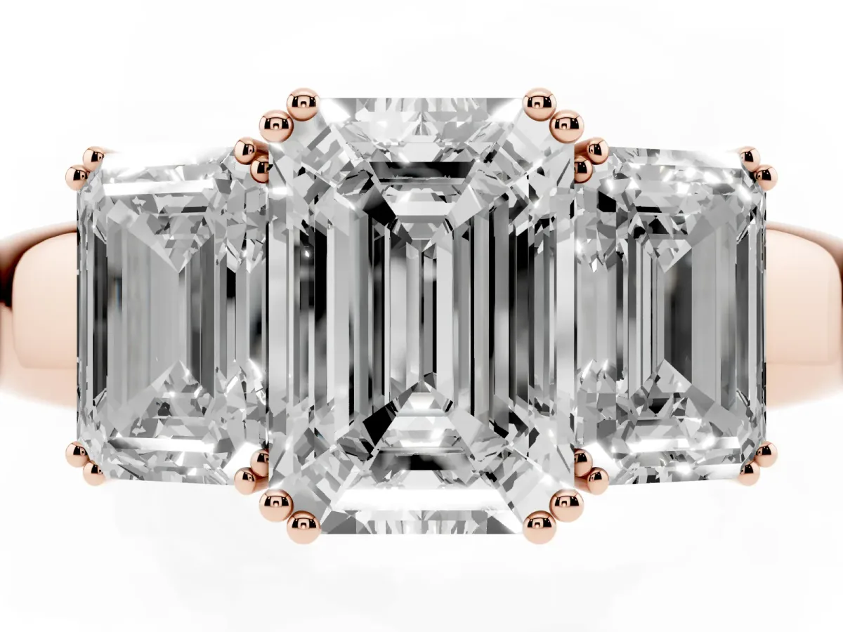 Three-Stone Emerald Cut Cut Diamond Ring with Channel Set Band and Four-Prong Setting Rose gold