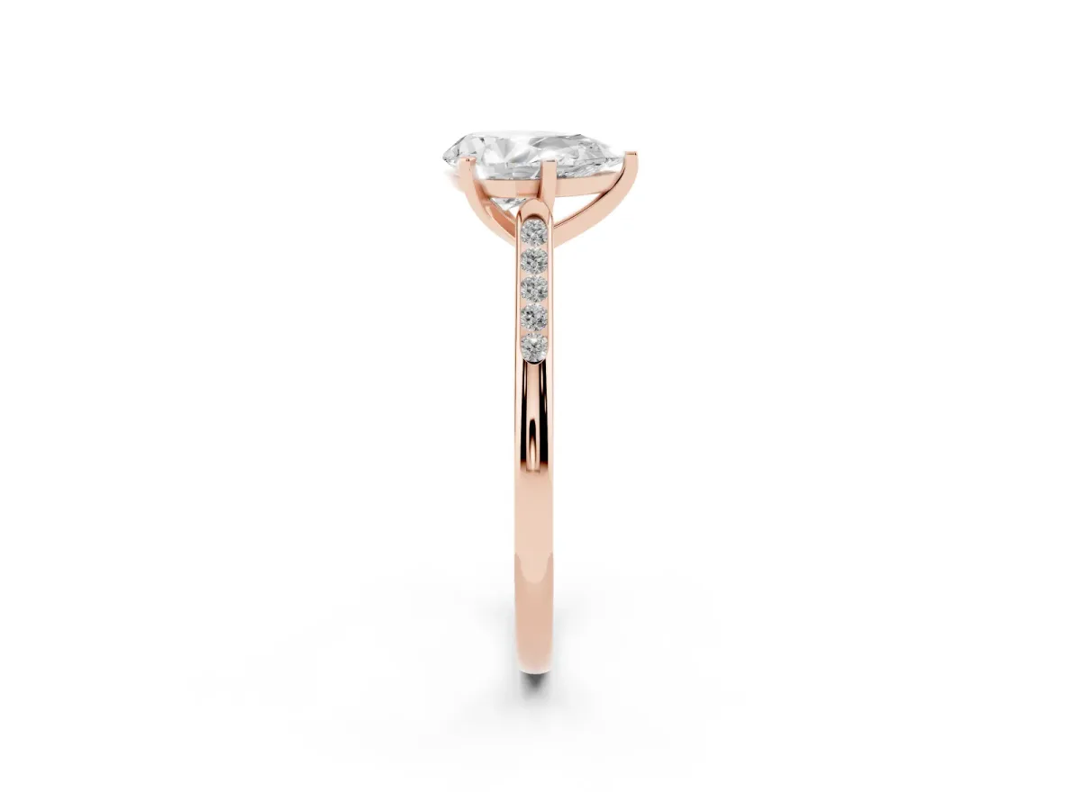 Pear Cut Diamond Solitaire Ring with Channel Set Round Band and Prong Setting Rose gold