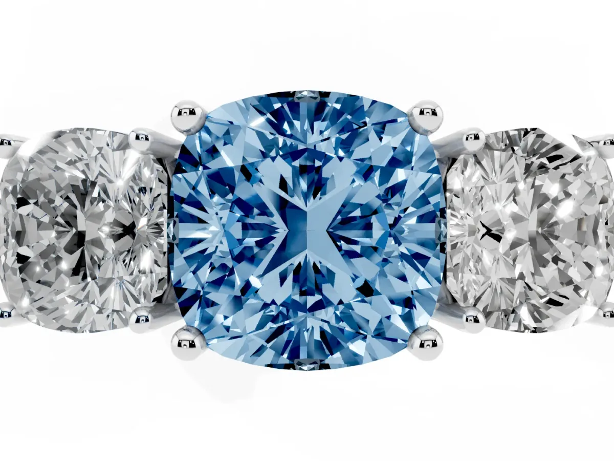 Fancy Blue Three-Stone Cushion Cut Cut Diamond Engagement Ring with Prong Setting on a White Gold Band Platinum