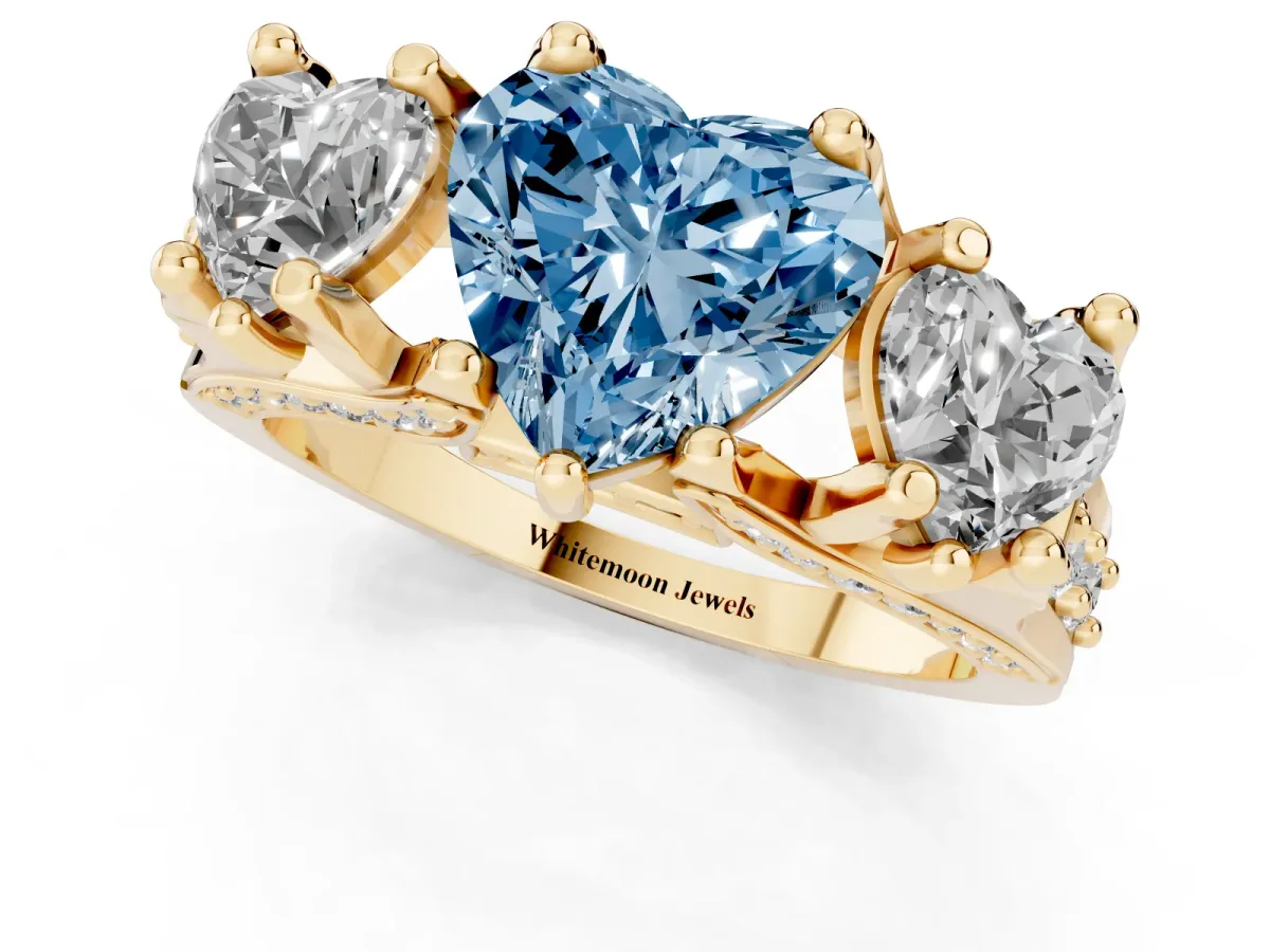 Fancy Blue Heart Cut Diamond Three-Stone Ring with Channel Set Band and Four-Prong Setting Yellow gold
