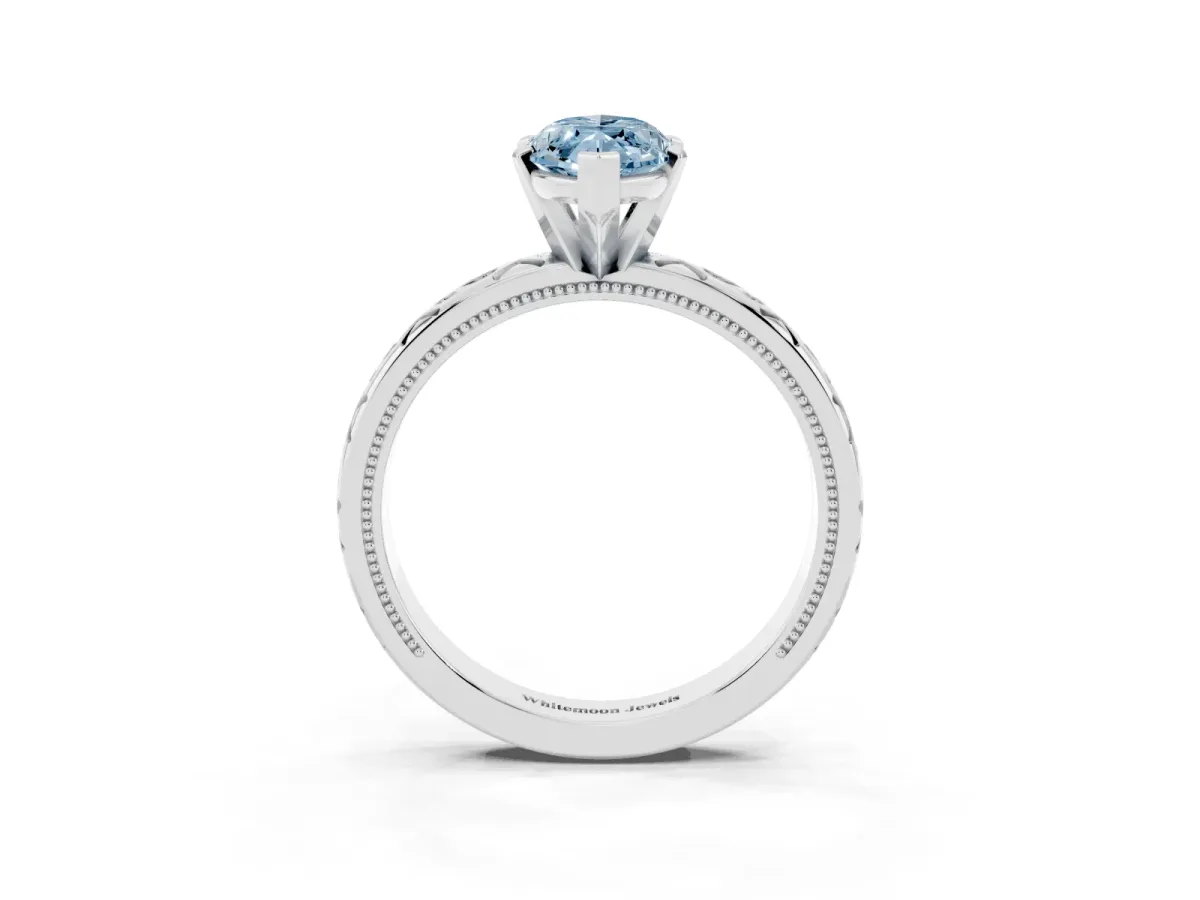 Fancy Blue Marquise Cut Solitaire Engagement Ring with Scrollwork Band and Four-Prong Setting Silver
