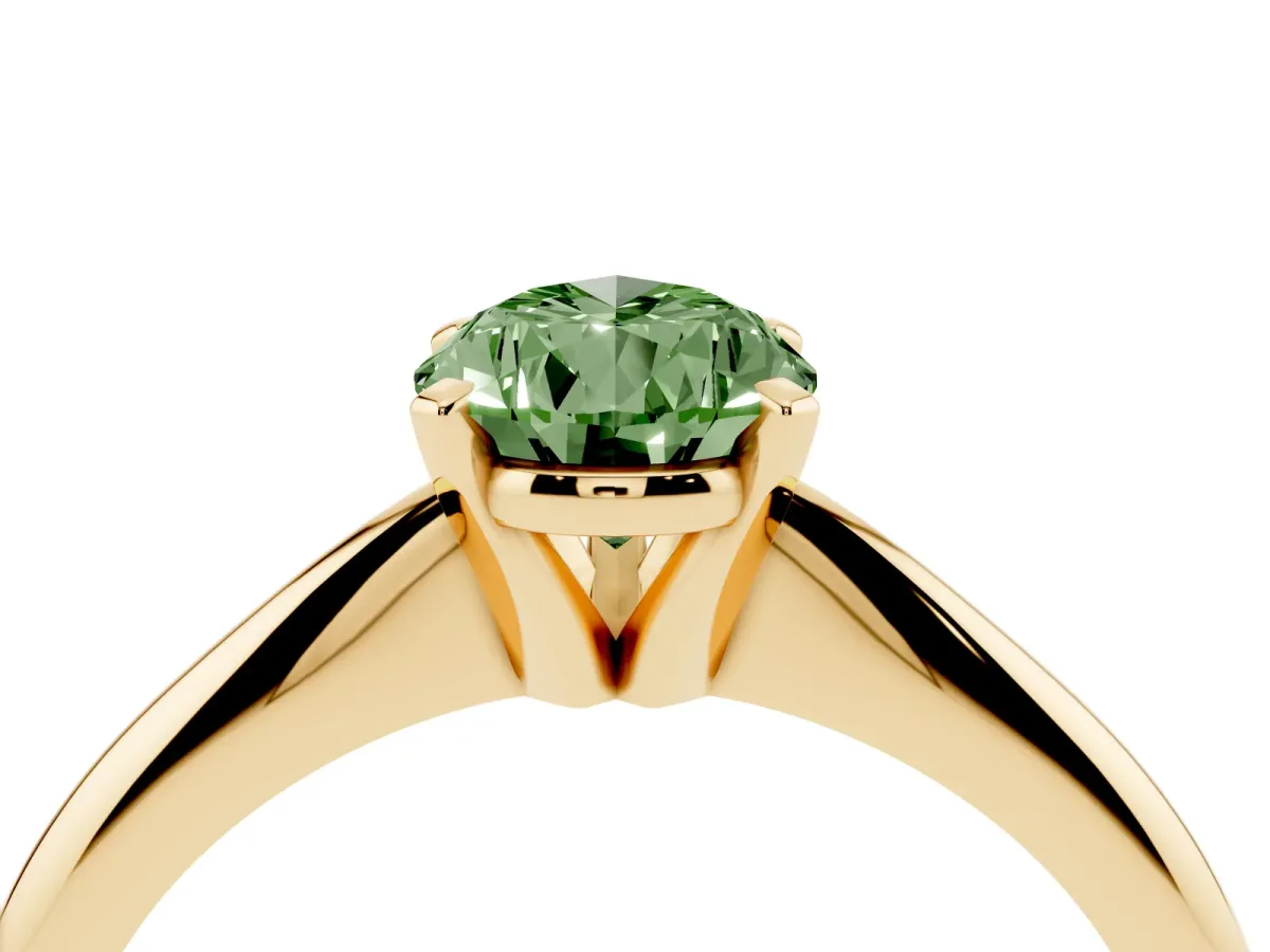 Fancy Green Pear Cut Cut Solitaire Ring with Four-Prong Setting on a Classic Band Yellow gold