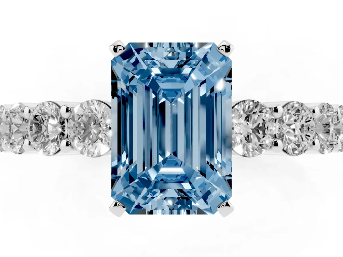 Fancy Blue Emerald Cut Diamond Solitaire Ring with Shared Prong Round Side Stones Platinum