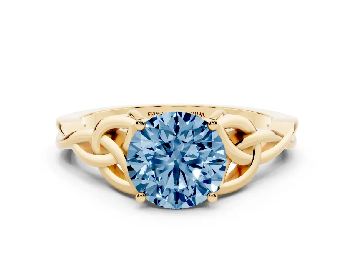 Fancy Blue Round Cut Diamond Solitaire Engagement Ring with Celtic Knot Band and Four-Prong Setting Yellow gold