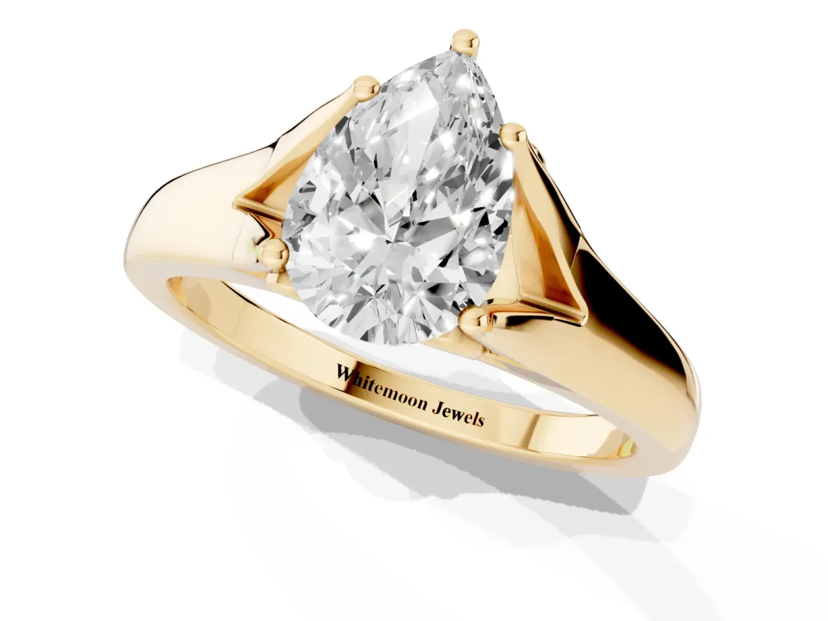 Pear Cut Solitaire Diamond Ring with Cathedral Band and Four-Prong Setting Yellow gold