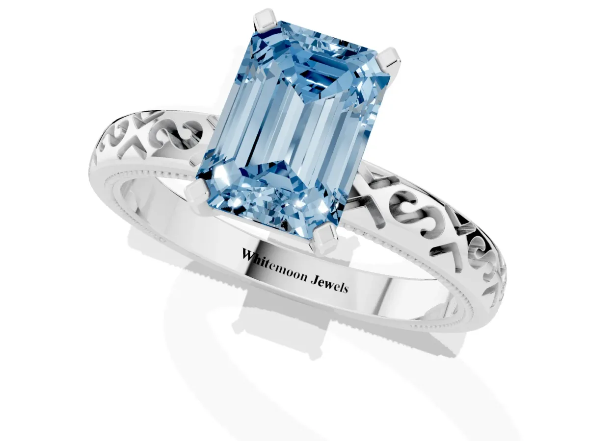Fancy Blue Emerald Cut Solitaire Engagement Ring with Scrollwork Band and Four-Prong Setting White gold
