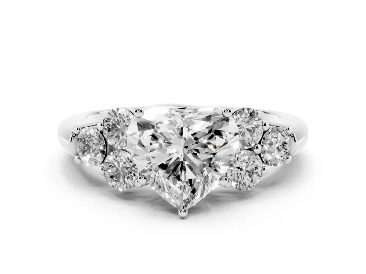 Heart Cut Cut Diamond Cluster Ring with Round Accent Stones and Prong Setting on a Classic Band White gold
