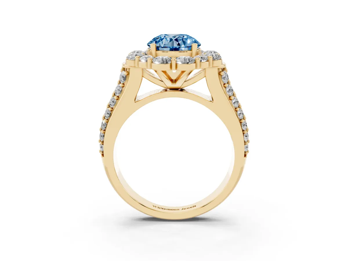 Fancy Blue Round Cut Halo Diamond Engagement Ring with Split Shank and Prong Setting Yellow gold