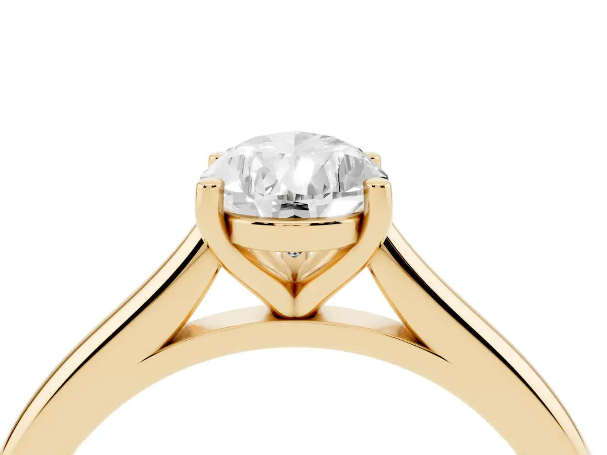 Pear Cut Cut Solitaire Ring with Cathedral Band and Four-Prong Setting Yellow gold