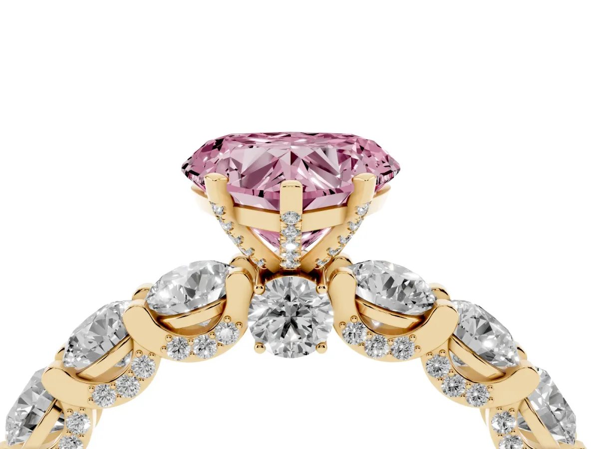 Fancy Pink Heart Cut Diamond Side Stone Engagement Ring with Four-Prong Setting Yellow gold