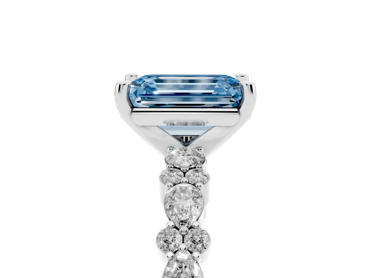 Fancy Blue Emerald Cut Diamond Side Stone Solitaire Ring with Round and Four-Prong Setting White gold