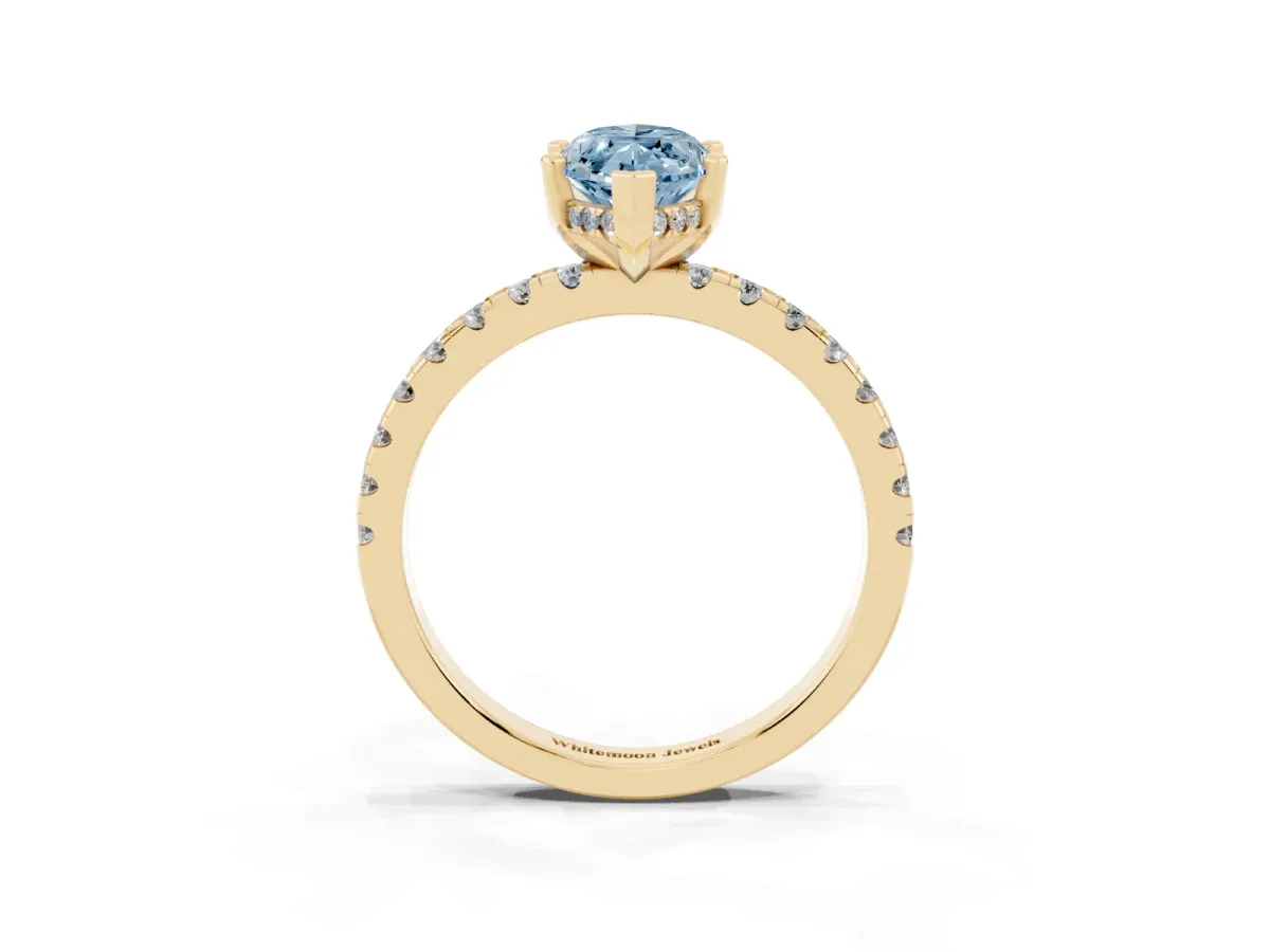 Fancy Blue Marquise Cut Diamond Solitaire Ring with Round Pavé Band and Four-Prong Setting Yellow gold