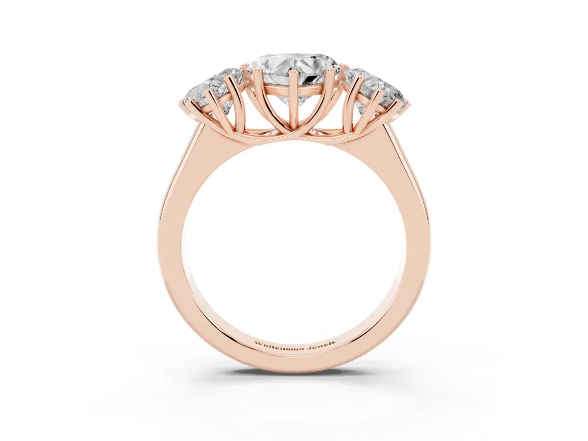 Heart Cut Three-Stone Diamond Ring with Prong Setting on a Classic Band Rose gold