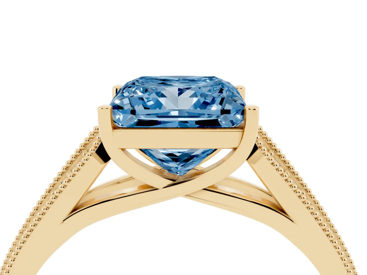 Fancy Blue Princess Cut Cut Pave Split Shank Engagement Ring with Four-Prong Setting Yellow gold