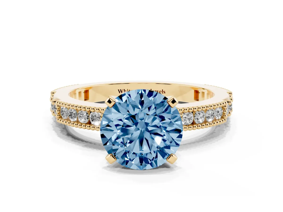 Fancy Blue Round Cut Solitaire with Pavé Band and Four-Prong Setting Yellow gold