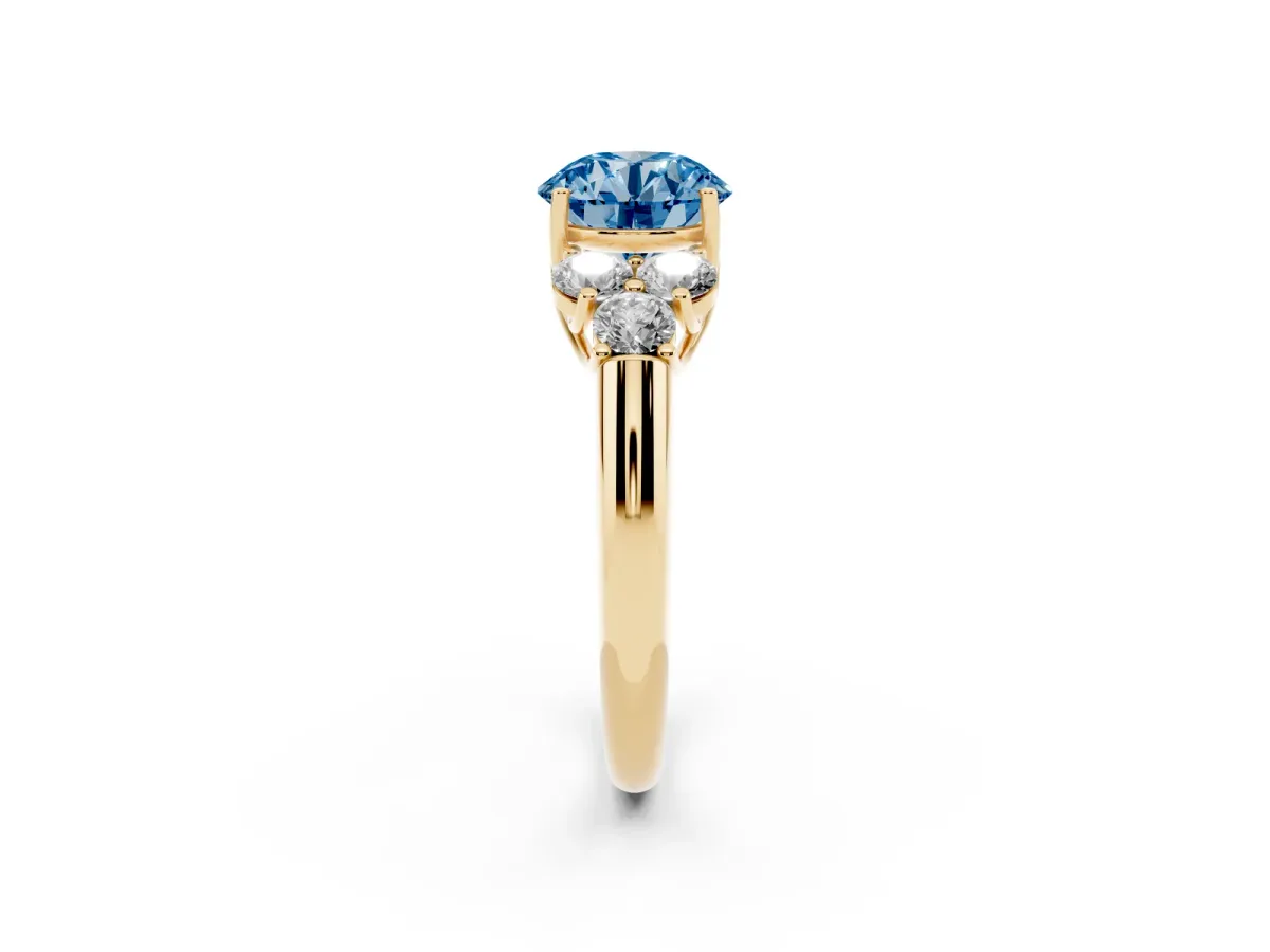 Fancy Blue Round Cut Cut Diamond Cluster Ring with Round Accent Stones and Prong Setting on a Classic Band Yellow gold