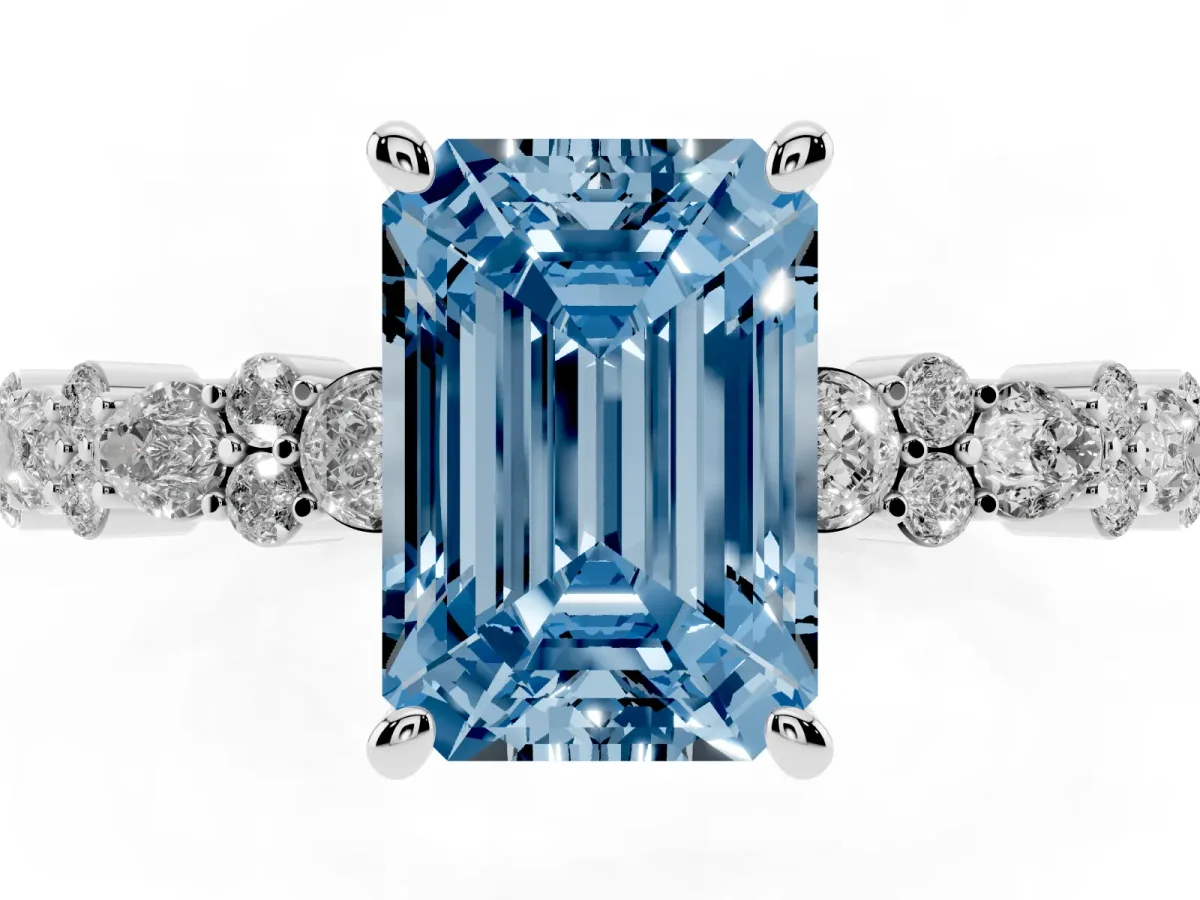 Fancy Blue Emerald Cut Diamond Side Stone Solitaire Ring with Round and Four-Prong Setting White gold