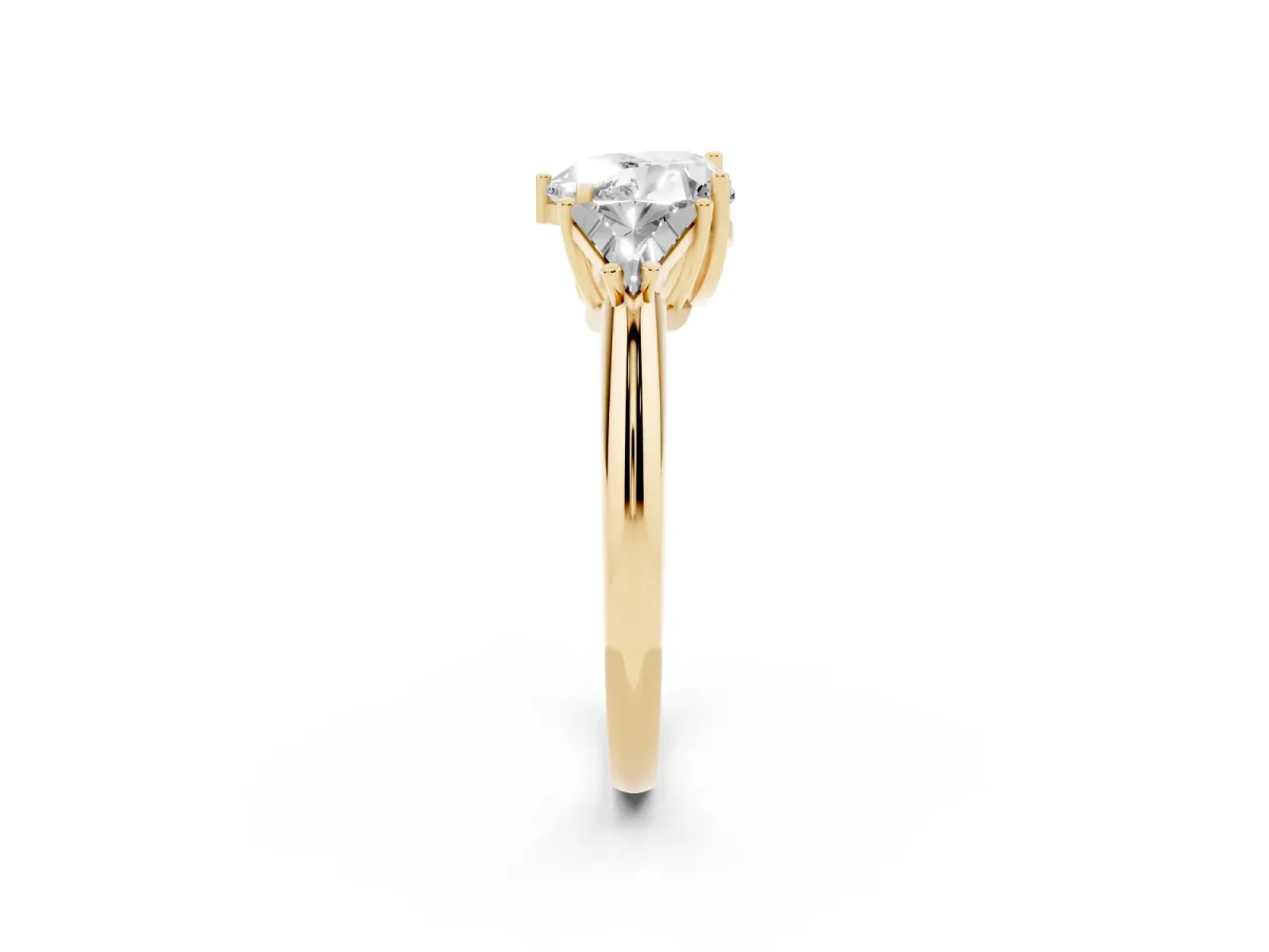 Three-Stone Heart Cut Diamond Engagement Ring with Trillion Side Stones and Prong Setting Yellow gold