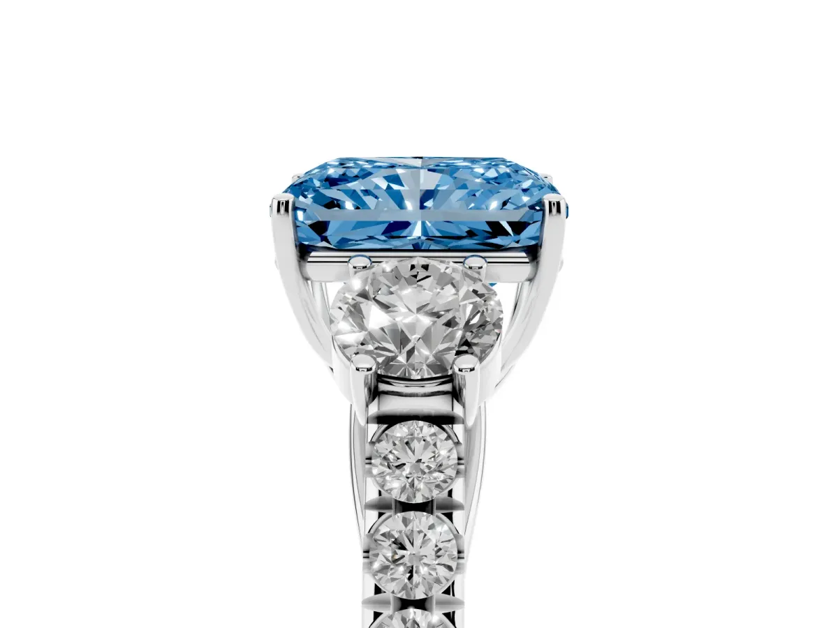 Fancy Blue Radiant Cut Cut Diamond Three-Stone Ring with Round Side Stones and Pavé Band White gold