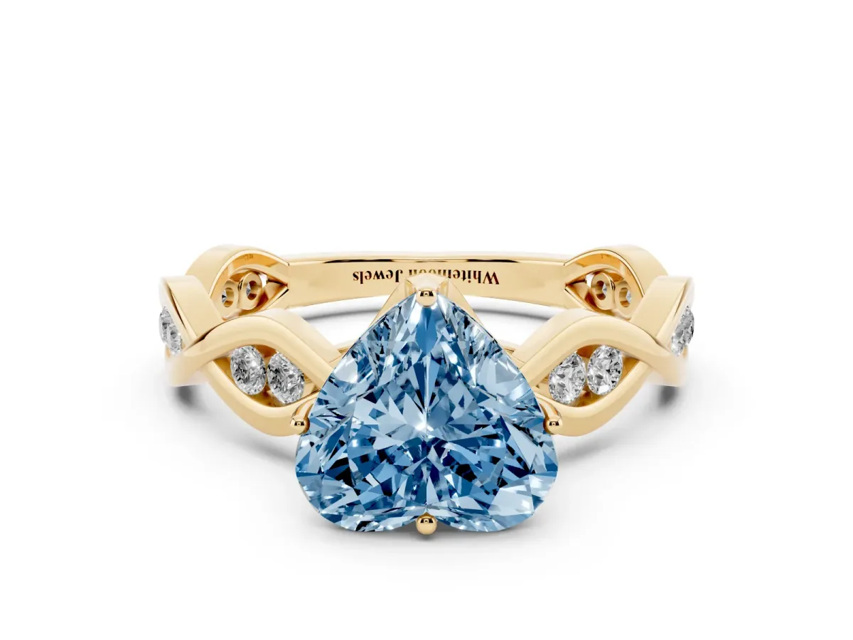 Fancy Blue Heart Cut Solitaire Twist Band with Leaf Prong Setting Yellow gold