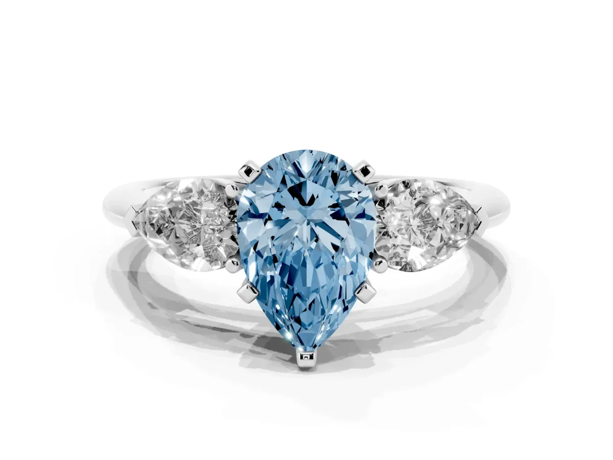 Fancy Blue Three-Stone Pear Cut Diamond Ring with Pear Side Stones and Four-Prong Setting Silver