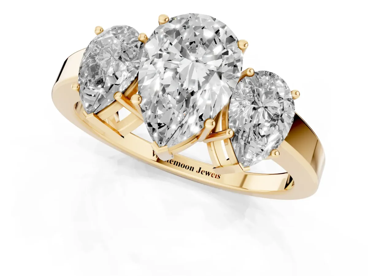 Three-Stone Pear Cut Cut Diamond Engagement Ring with Flat Band and Four-Prong Setting Yellow gold