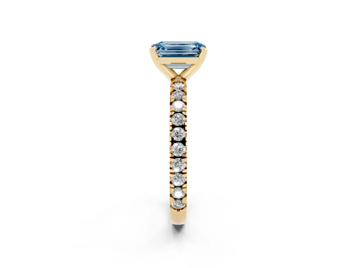 Fancy Blue Emerald Cut Diamond Pavé Band Solitaire with Four-Prong Setting Yellow gold