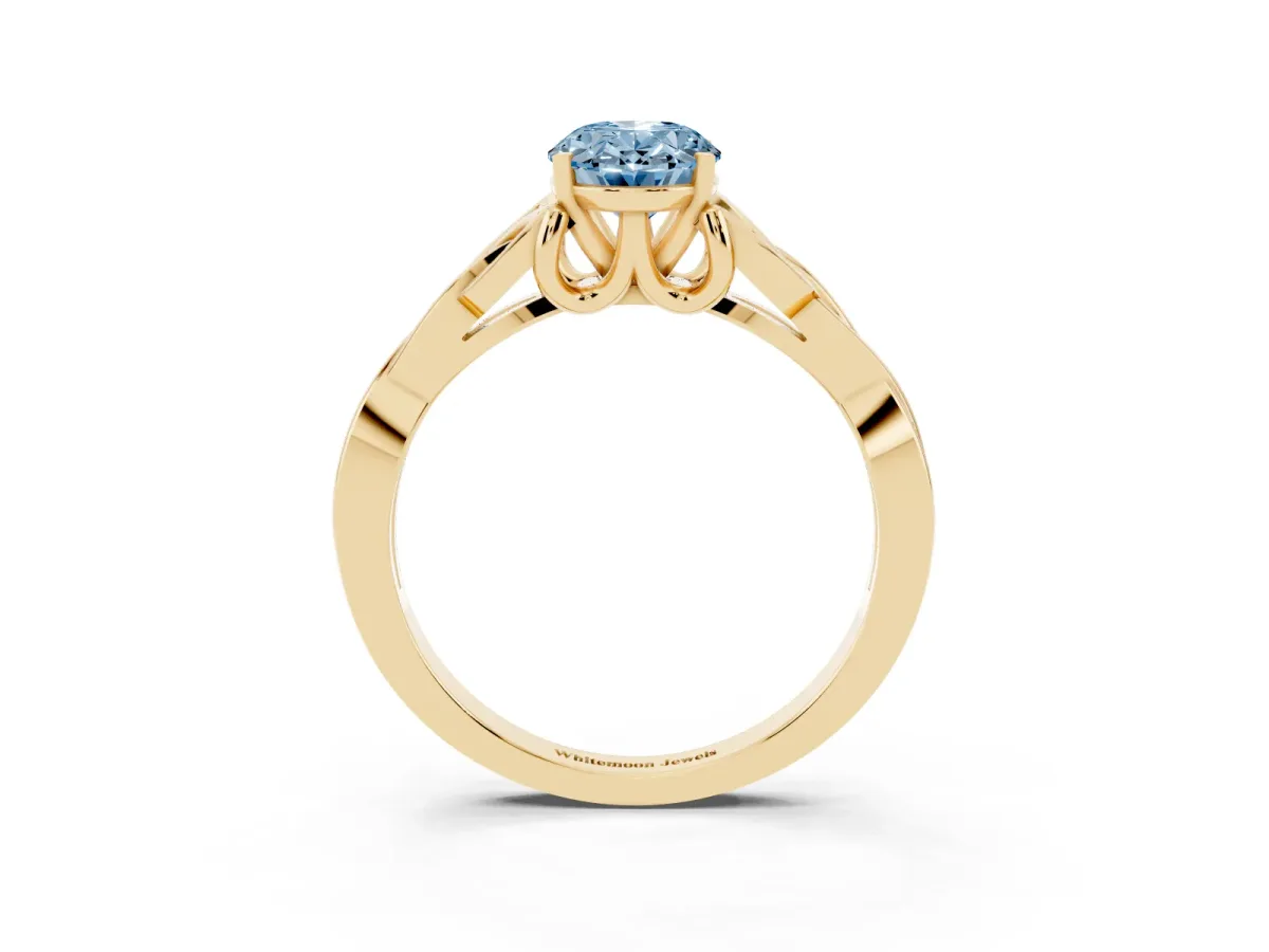 Fancy Blue Oval Cut Diamond Solitaire Engagement Ring with Celtic Knot Band and Four-Prong Setting Yellow gold