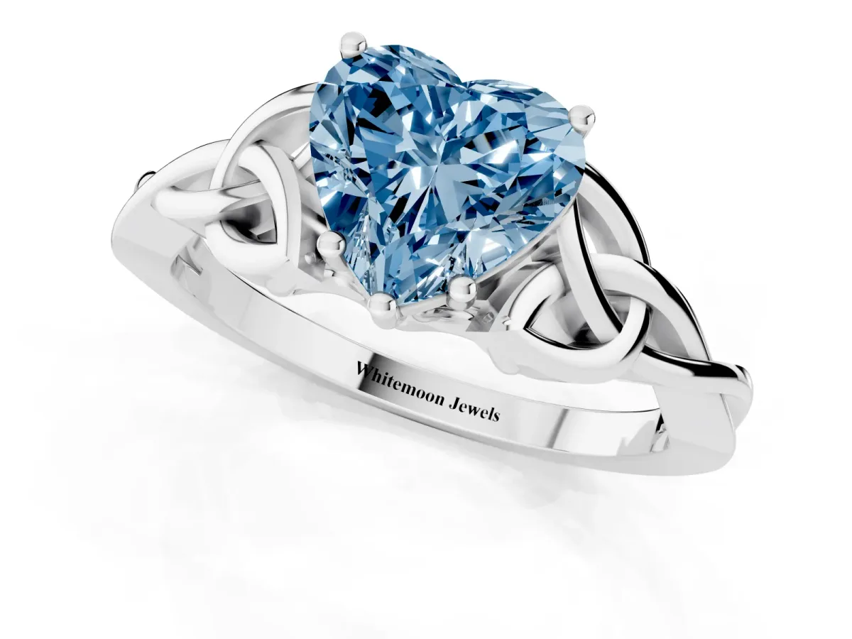 Fancy Blue Heart Cut Diamond Solitaire Engagement Ring with Celtic Knot Band and Four-Prong Setting Silver