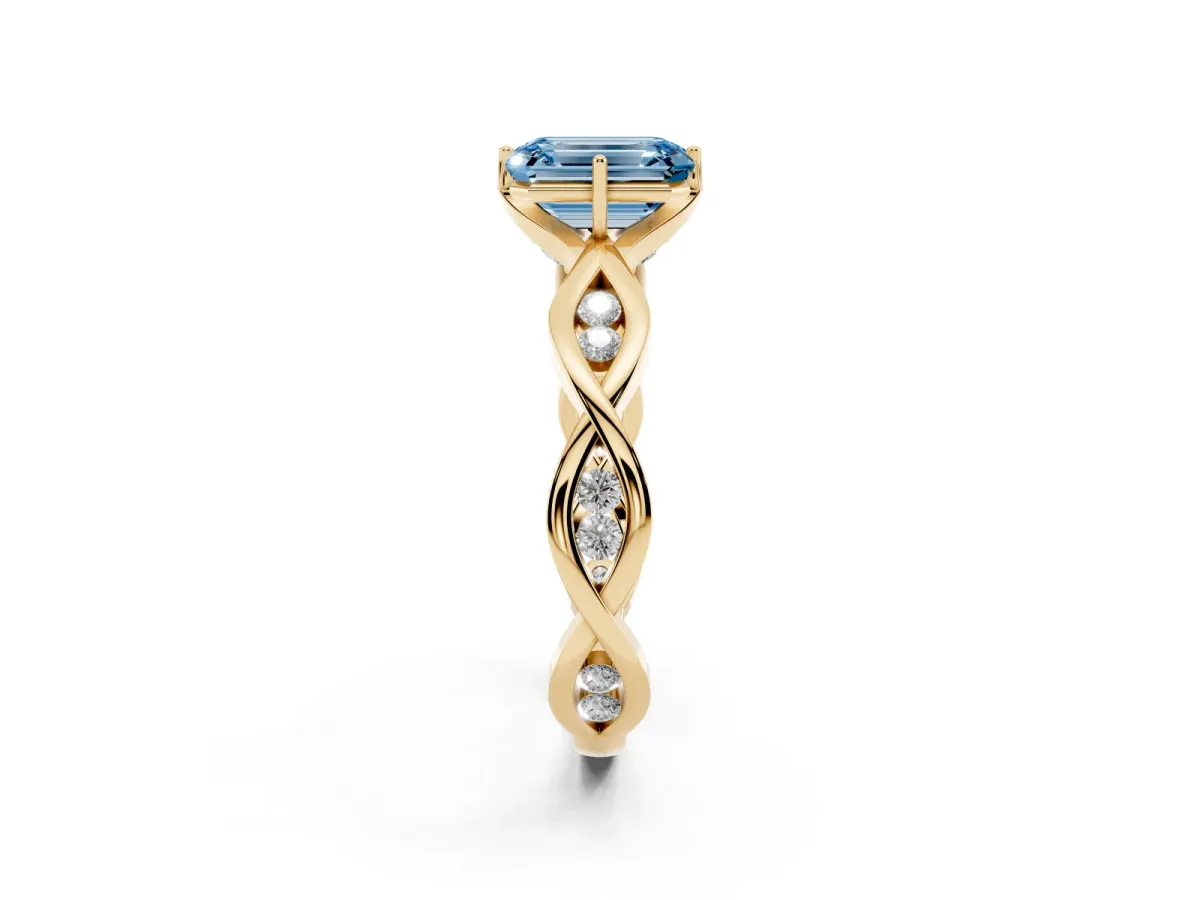 Fancy Blue Emerald Cut Solitaire Twist Band with Leaf Prong Setting Yellow gold