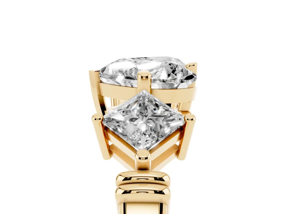 Three-Stone Heart Cut and Princess Cut Diamond Ring with Channel Band and Four-Prong Setting Yellow gold