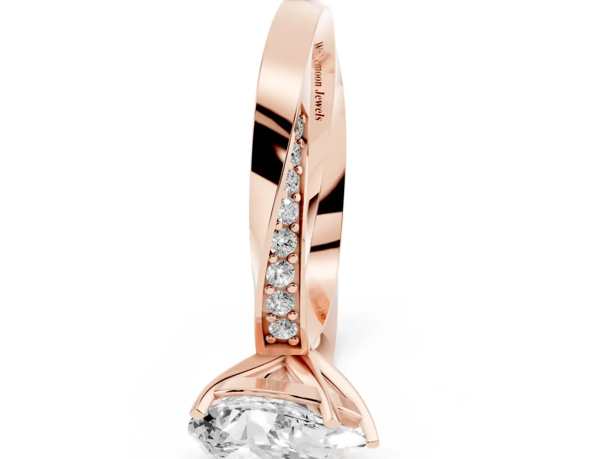 Pear Cut Diamond Engagement Ring with Side Stone Accents and Four-Prong Setting Rose gold