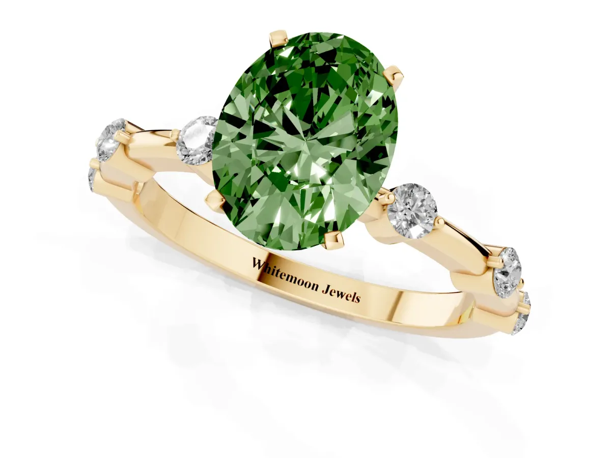 Fancy Green Oval Cut Solitaire Diamond Ring with Bezel Set Side Stones and Prong Setting Yellow gold