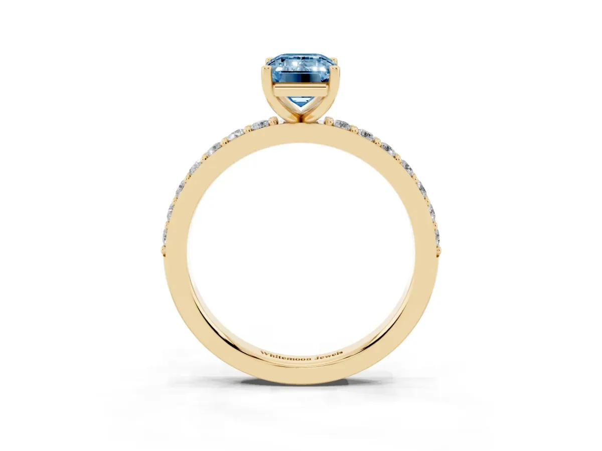 Fancy Blue Emerald Cut Cut Diamond Solitaire with Pave Band and Four-Prong Setting Yellow gold