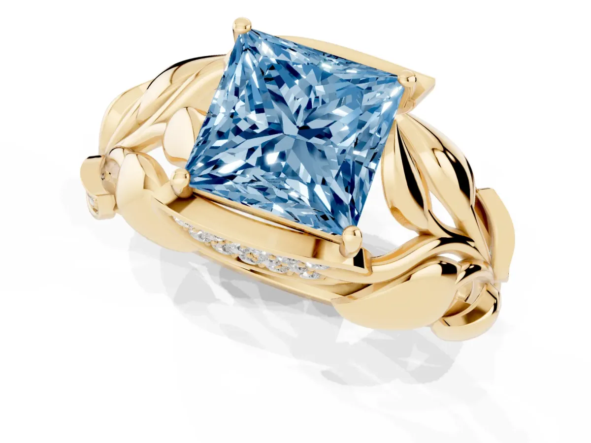 Fancy Blue Princess Cut Diamond Leaf-Inspired Engagement Ring with Round Accents and Prong Setting Yellow gold