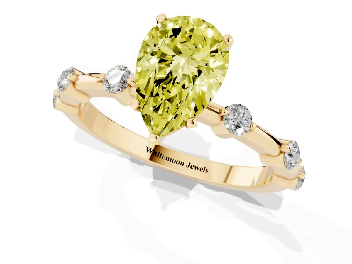 Fancy Yellow Pear Cut Solitaire Diamond Ring with Bezel Set Side Stones and Prong Setting Yellow gold