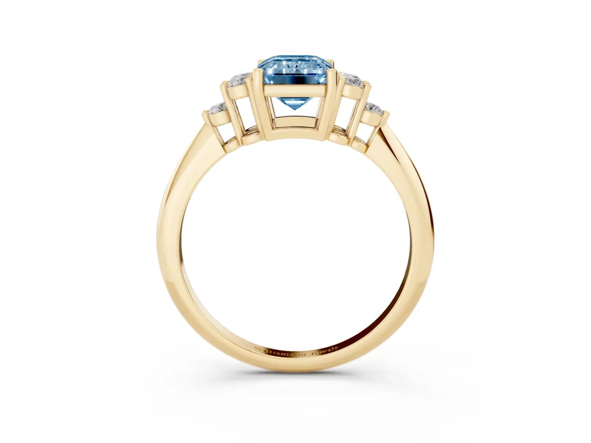 Fancy Blue Emerald Cut Cut Diamond Cluster Ring with Solitaire Band and Four-Prong Setting Yellow gold