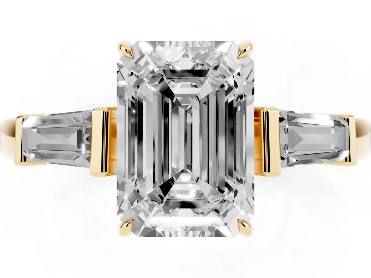 Emerald Cut Diamond Three-Stone Ring with Tapered Baguette Side Stones and Prong Setting Yellow gold