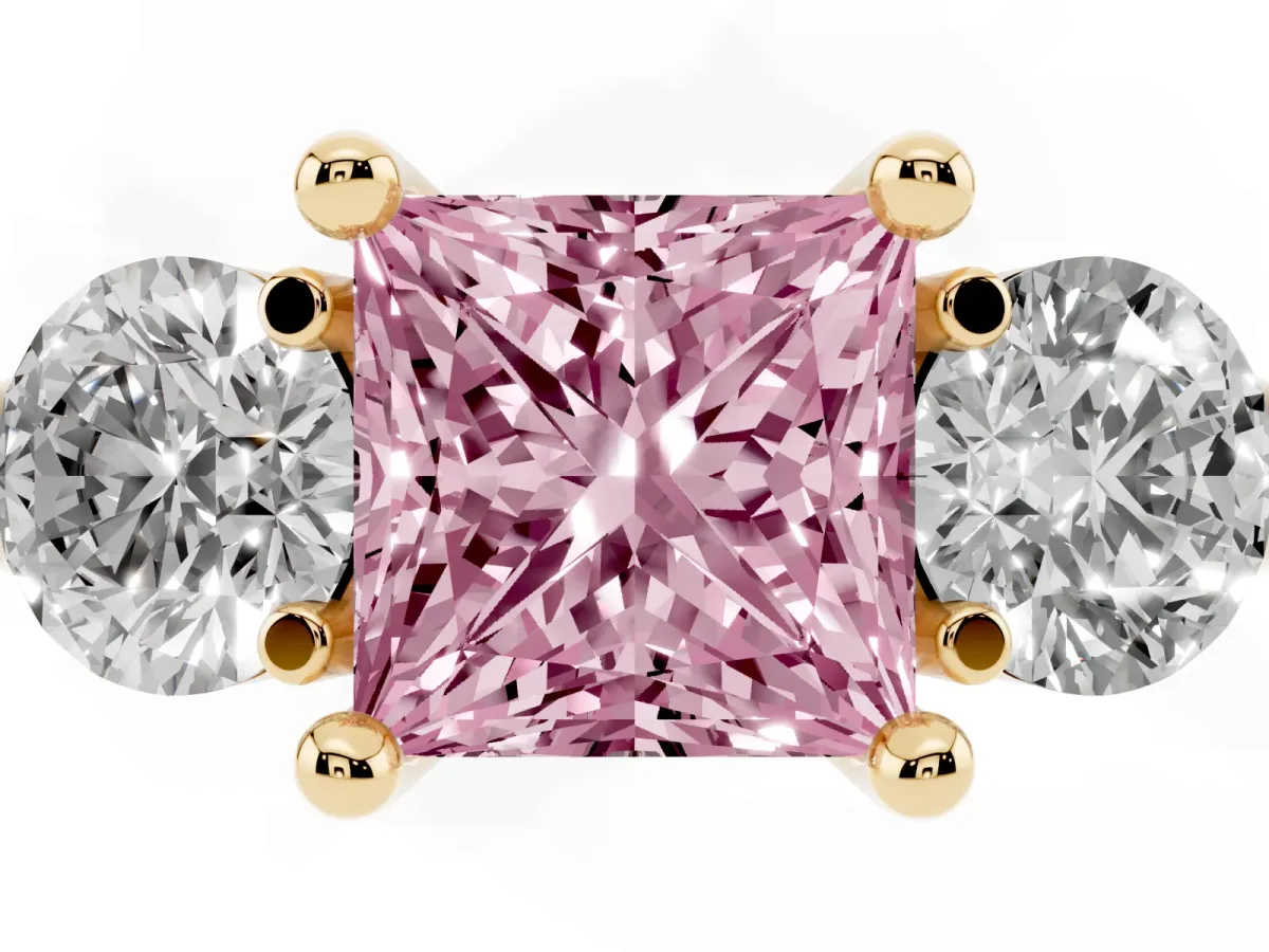 Fancy Pink Three-Stone Princess Cut Brilliant Cut Solitaire Ring with Prong Setting on a Classic Band Yellow gold