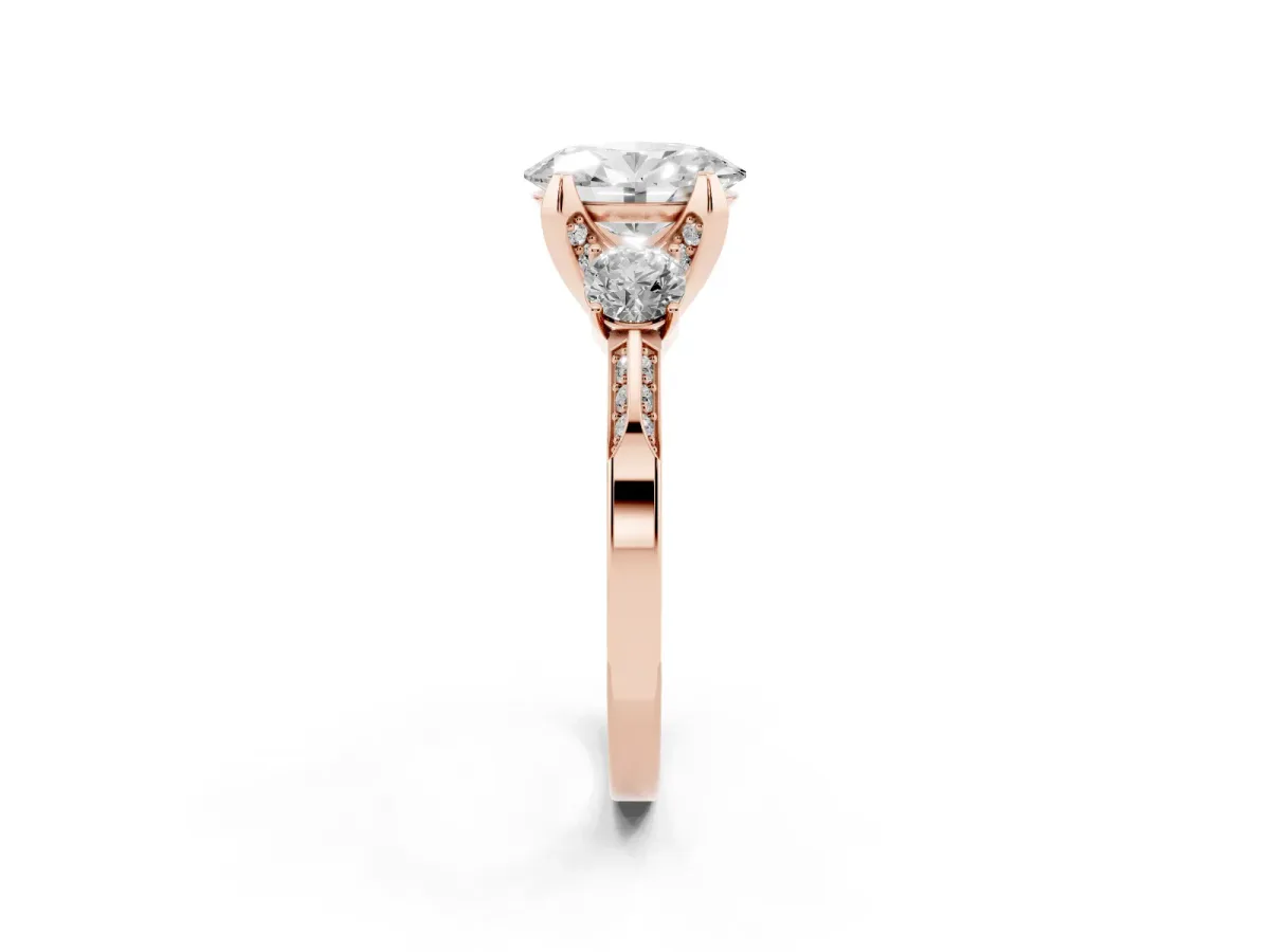 Oval Cut Brilliant Three-Stone Diamond Ring with Pavé Band and Four-Prong Setting Rose gold