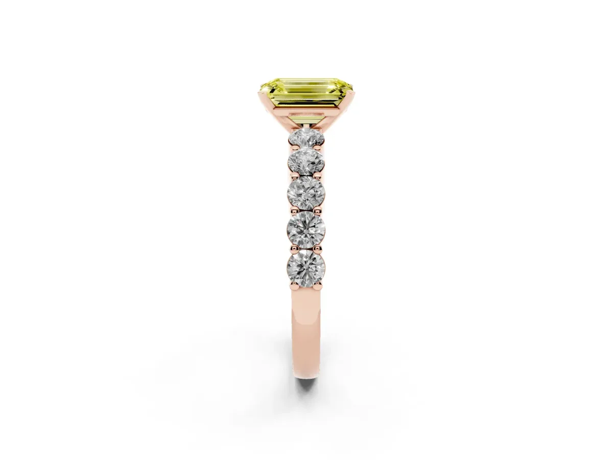 Fancy Yellow Emerald Cut Diamond Solitaire Ring with Shared Prong Round Side Stones Rose gold