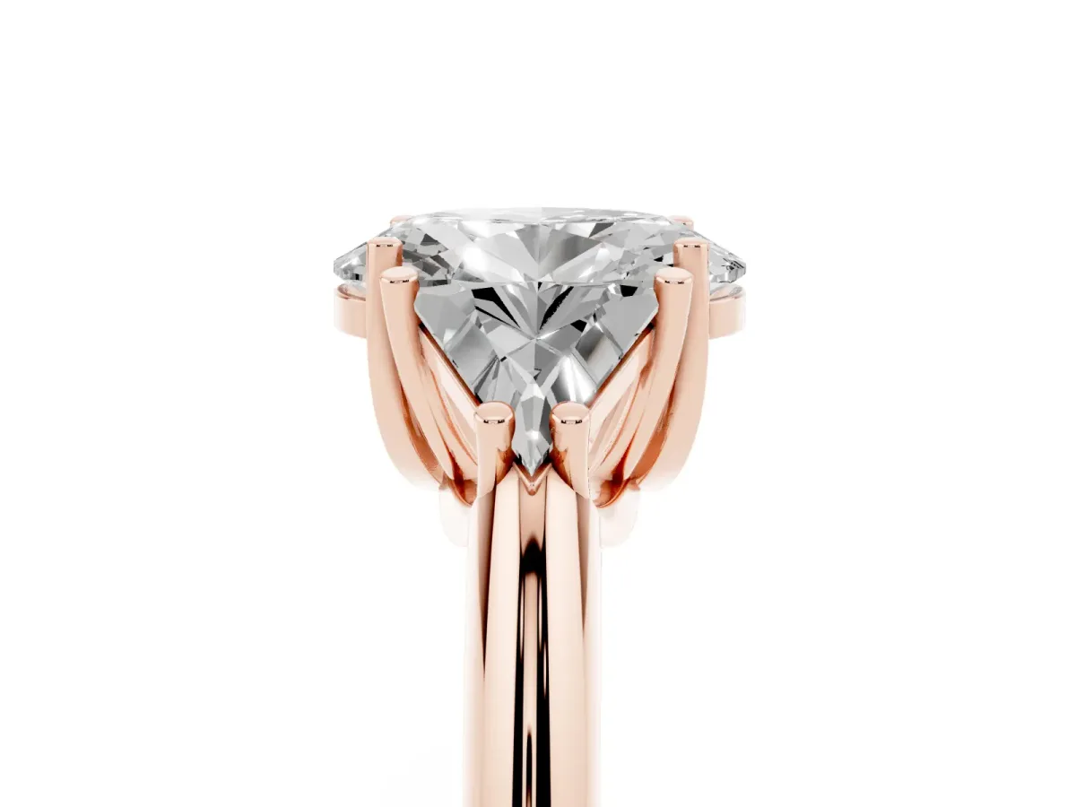 Three-Stone Oval Cut Diamond Engagement Ring with Trillion Side Stones and Prong Setting Rose gold